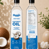 Two bottles of Meadow's Wood-Pressed Coconut Oil are displayed side-by-side on a wooden surface, showing both the front label and the back nutrition panel. The bottles are styled with coconuts, a small bowl of white coconut pieces, and green leaves against a warm beige background.