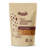 A stand-up pouch of Meadows Organic Jaggery Powder on a plain white background. The packaging is beige with dark brown text and illustrations, featuring a clear window showing the jaggery pieces inside.
